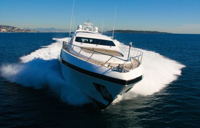 Small yacht powering through the Mediterranean sea