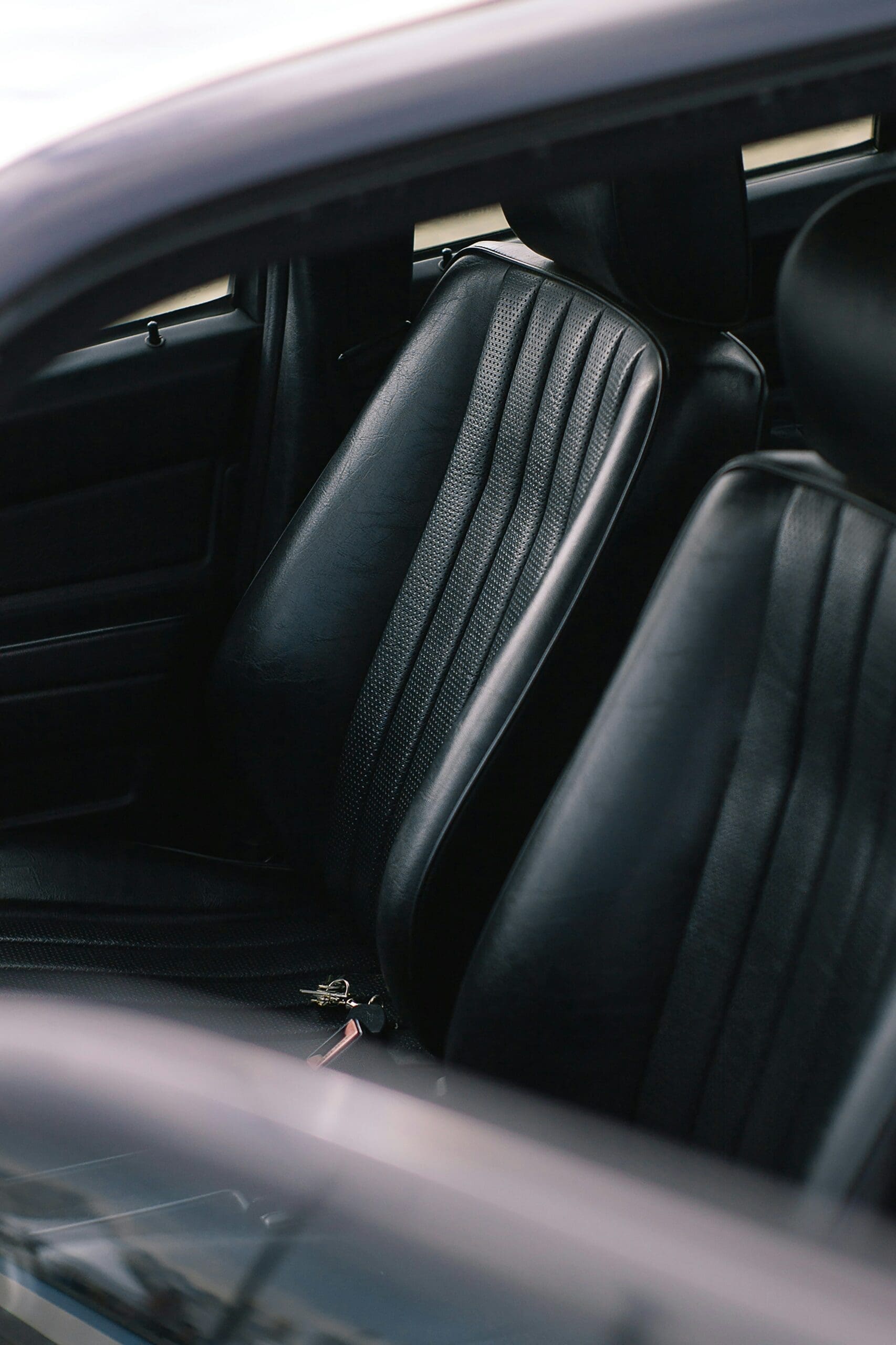 Black car interior focusing on leather seats