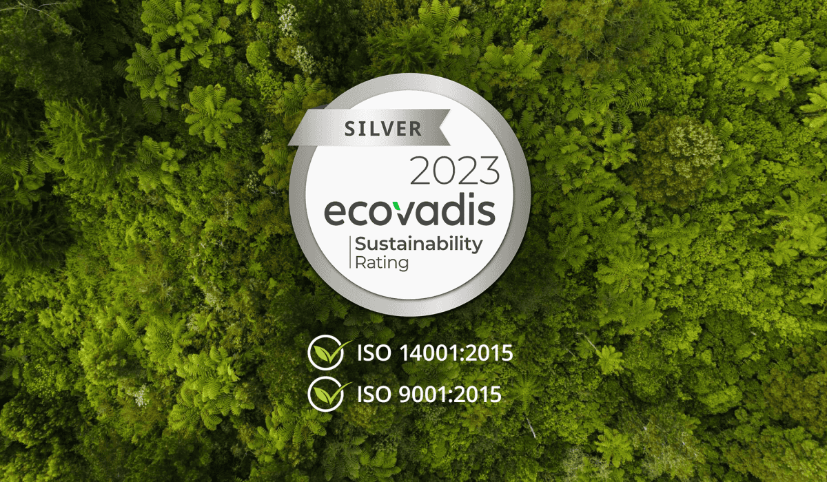Ecovadis silver certification badge on-top of an aerial shot of a forested area